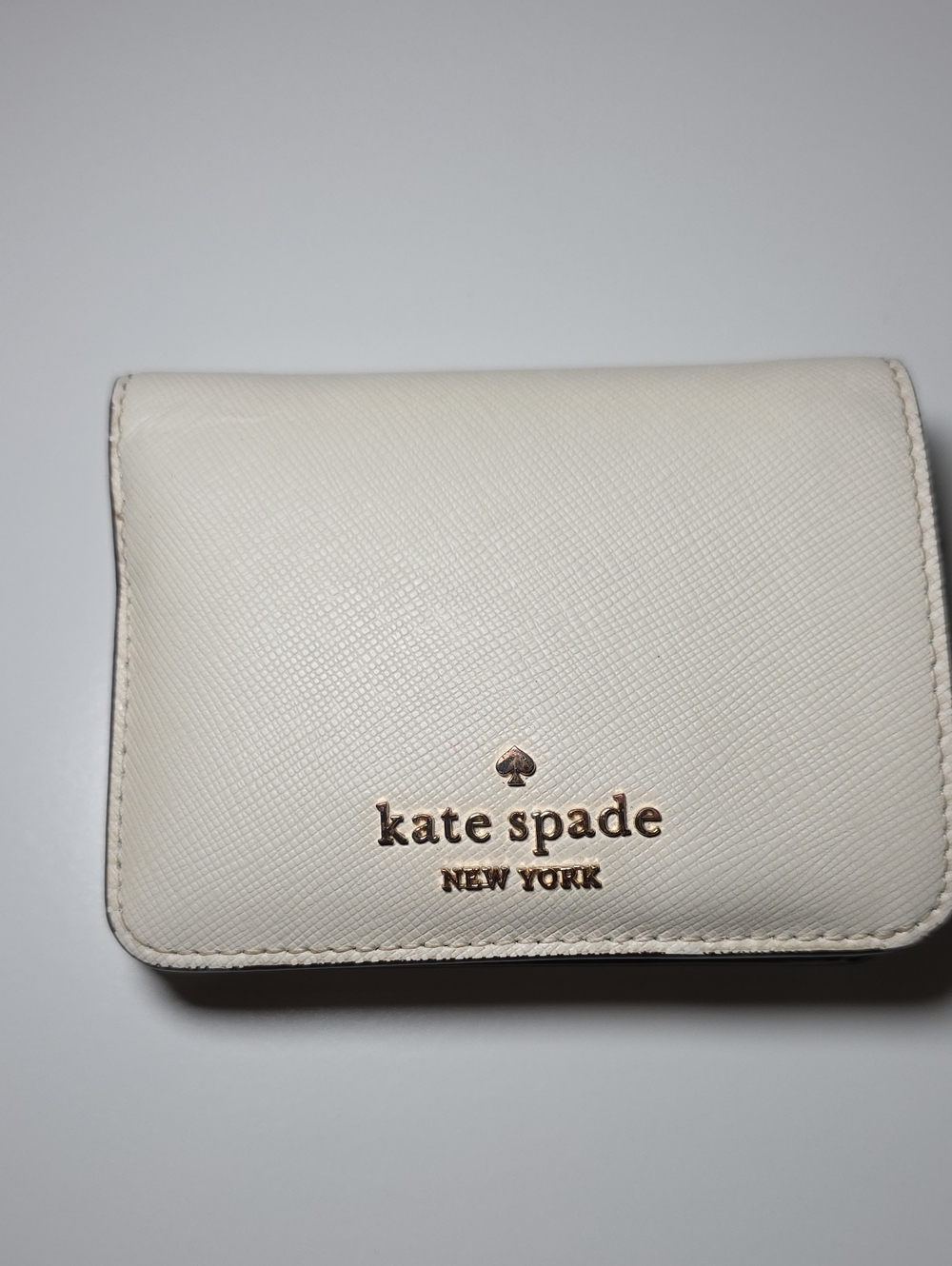 kate spade Cream Saffiano Compact Wallet with Gold Logo